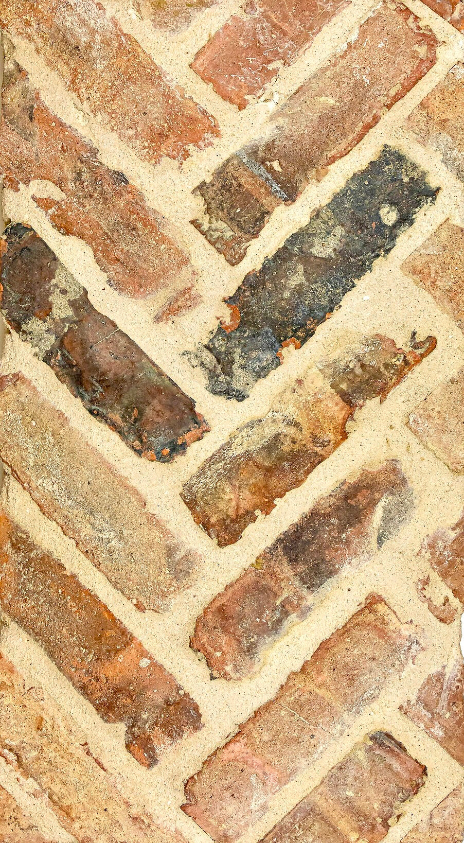 Reclaimed Chicago brick installed in a herringbone pattern.