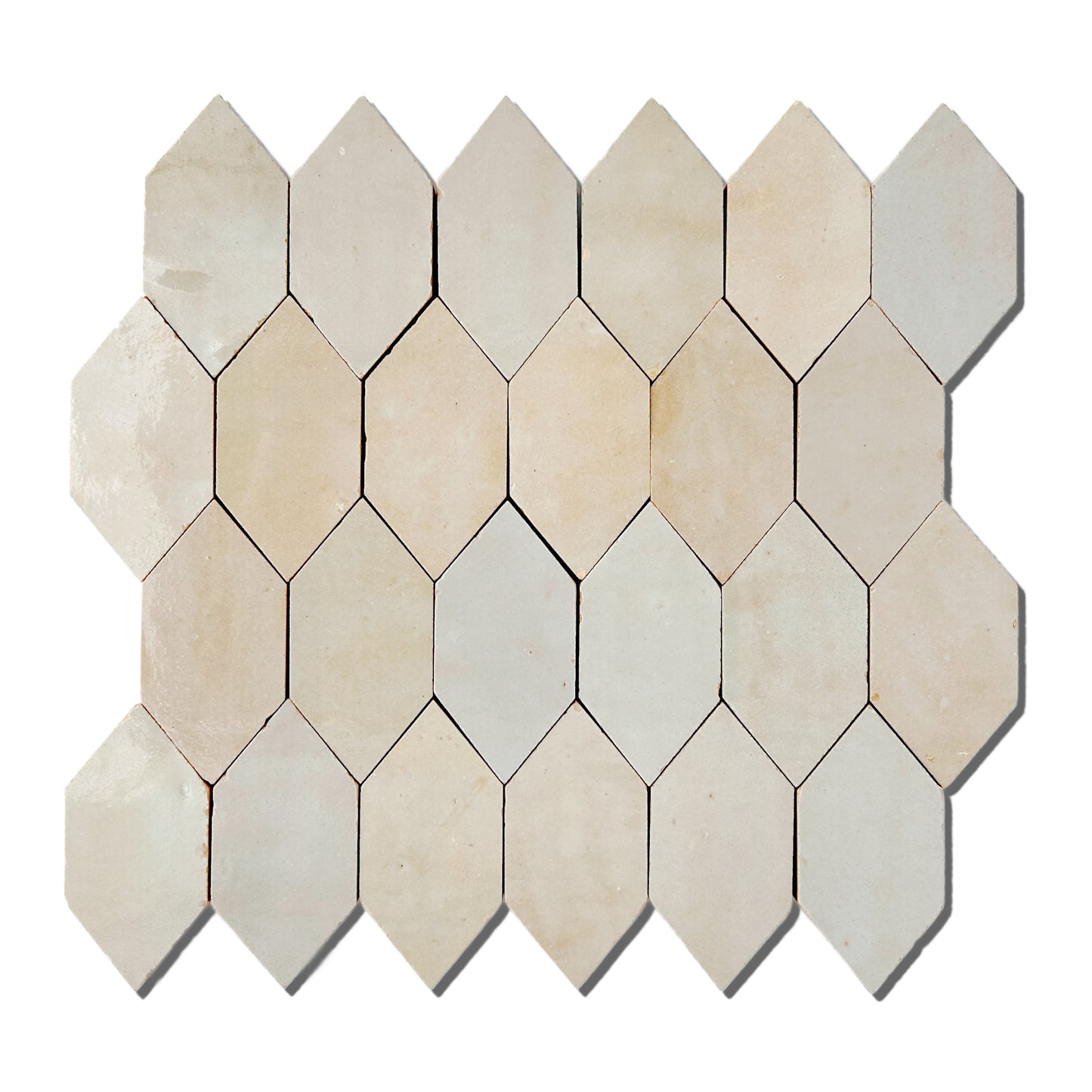 Zellige mosaic tile in a picket aka enlongated hexagon shape. The glossy grey beige glaze color has a natural variation from tile to tile.