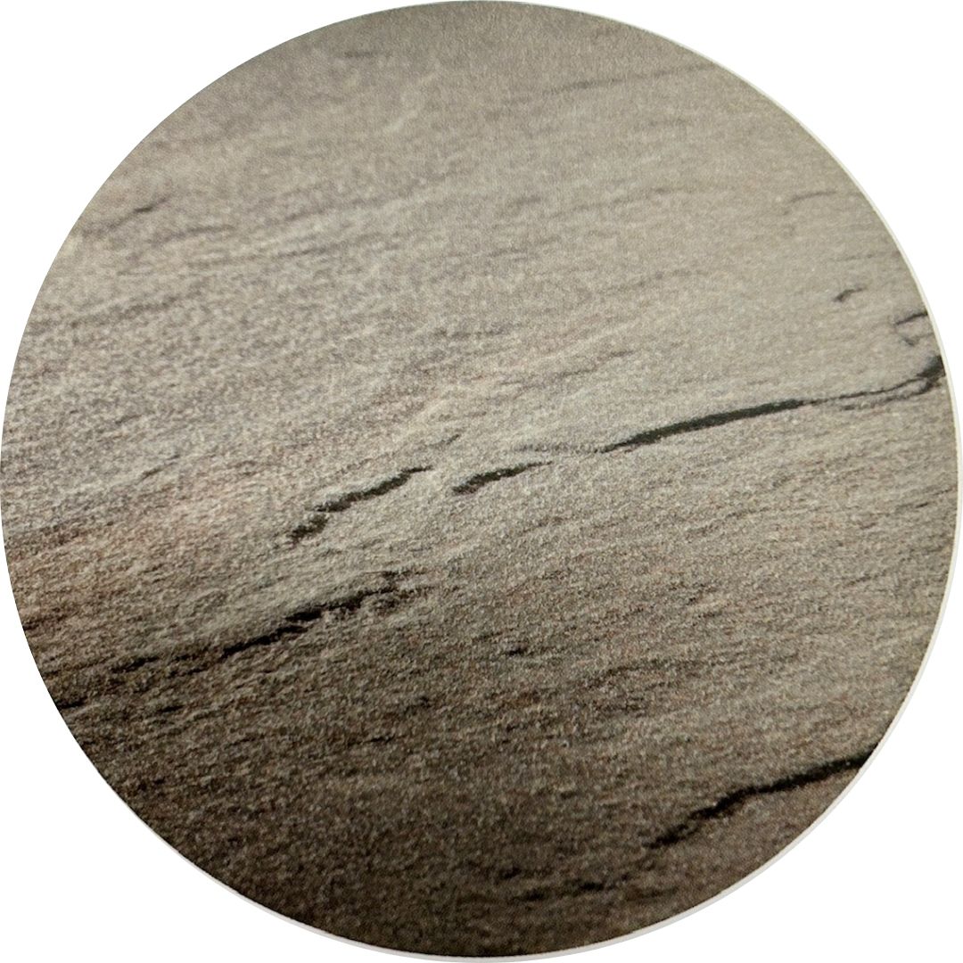 Close up of the cleft texture on a Bluestone Full Color porcelain paver tile.