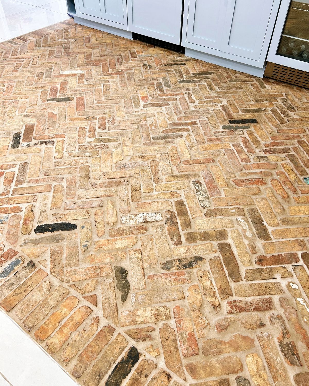 Installation of a reclaimed Chicago brick floor.