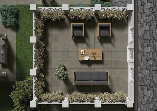 Aerial view of outdoor seating area. Shows modern furniture and the color variation of the porcelain pavers on the patio ground.