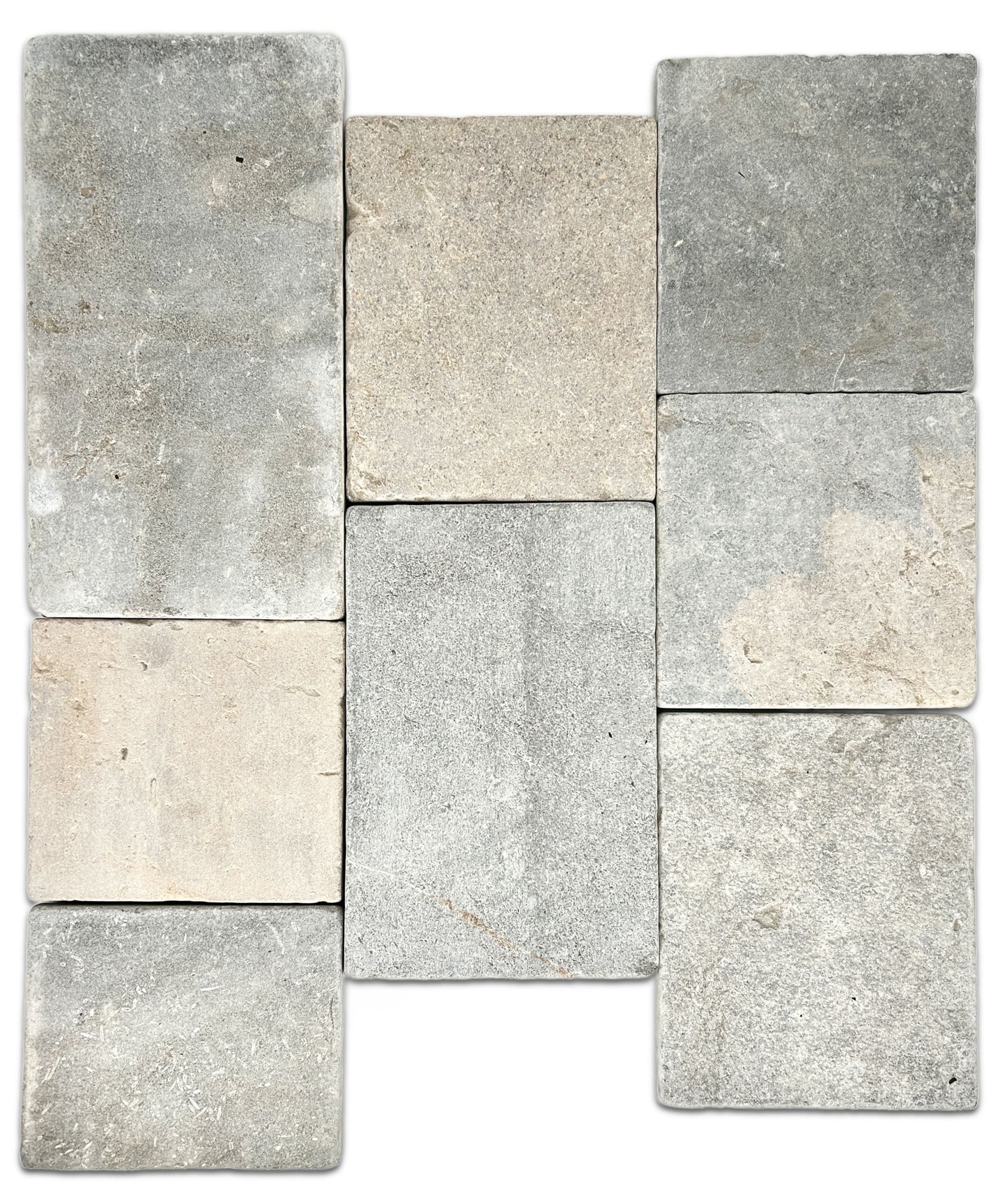 Eight limestone tiles in various shades of gray and beige on a white background.