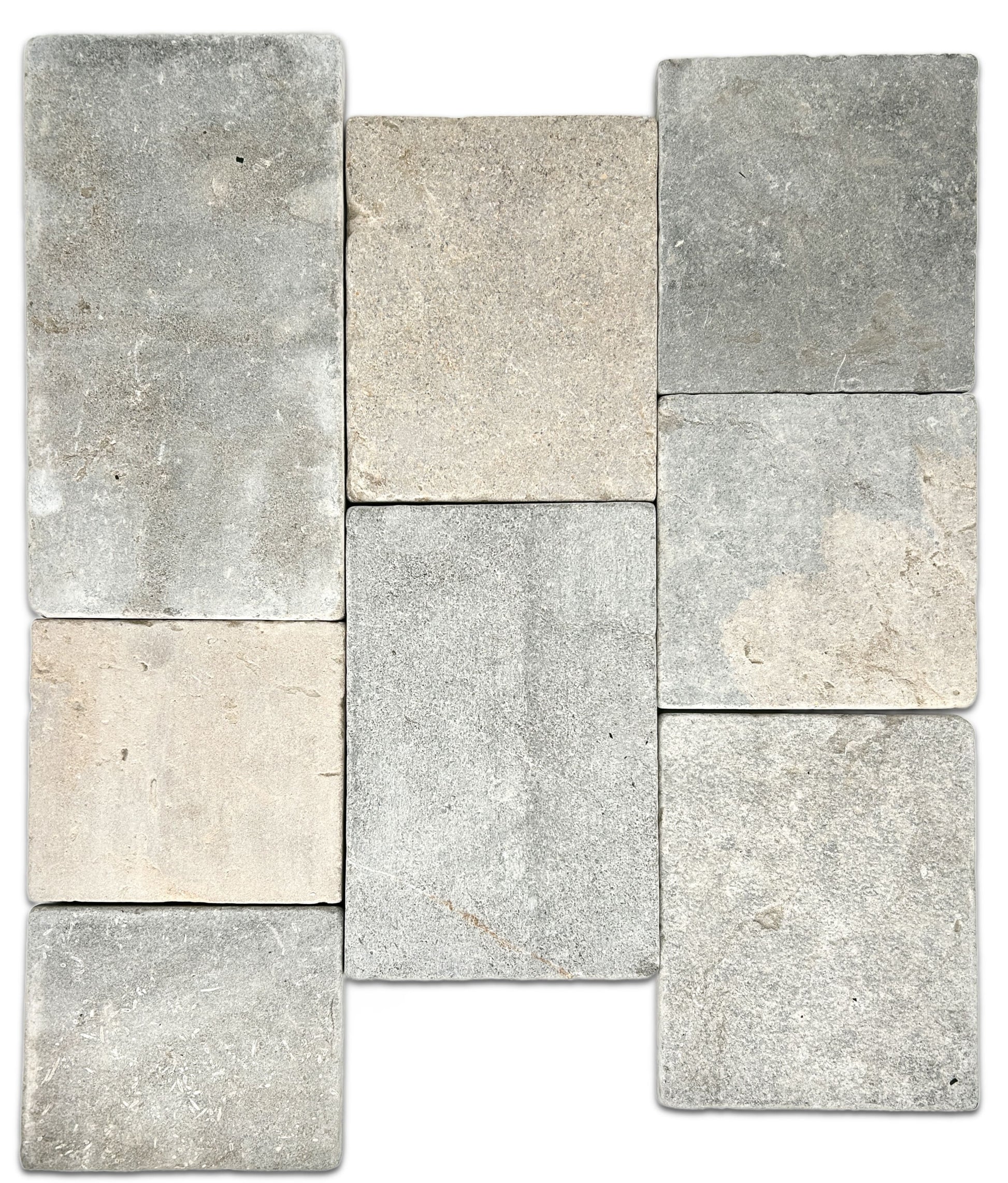 Eight limestone tiles in various shades of gray and beige on a white background.